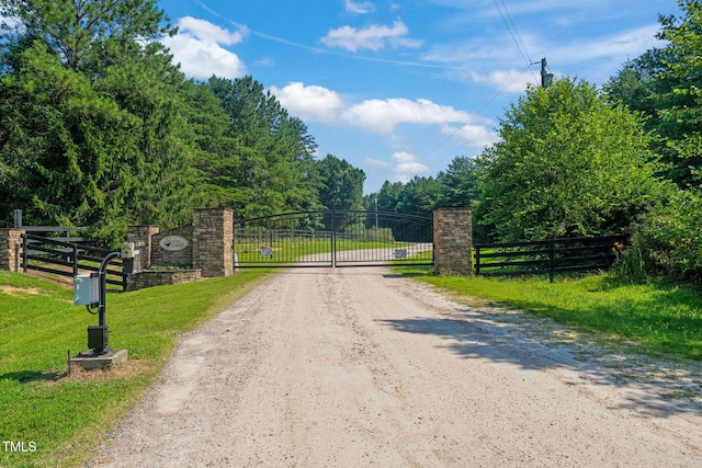80 Shartree Farms Ln, Louisburg, NC 27549 - view of dirt / gravel road with a gate