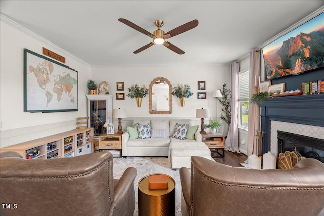 817 Mossy Oak Dr, Fuquay Varina, NC 27526 - living area with a fireplace, ceiling fan, ornamental molding, and wood finished floors