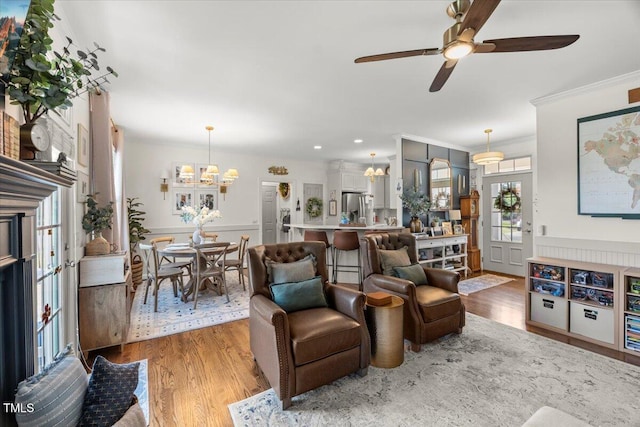 817 Mossy Oak Dr, Fuquay Varina, NC 27526 - living area with a chandelier, wood finished floors, ornamental molding, a ceiling fan, and recessed lighting