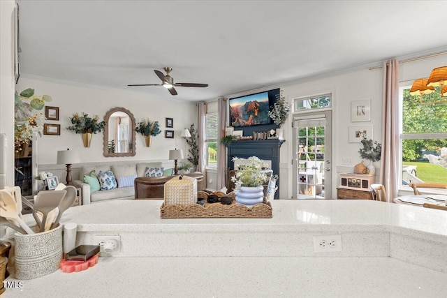 817 Mossy Oak Dr, Fuquay Varina, NC 27526 - living area featuring crown molding, ceiling fan, and a fireplace