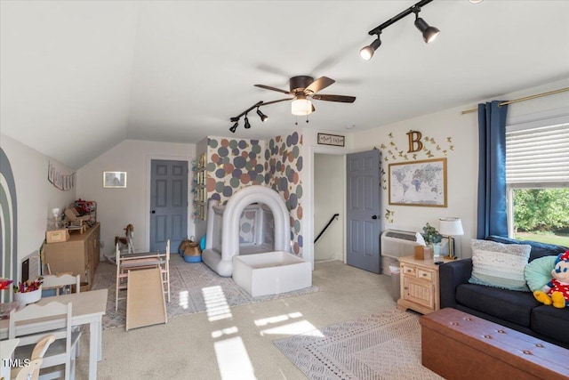 817 Mossy Oak Dr, Fuquay Varina, NC 27526 - carpeted living room with rail lighting, a ceiling fan, lofted ceiling, and a wall mounted AC