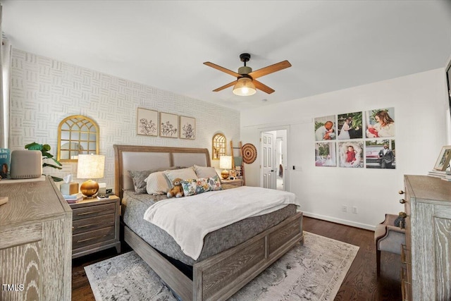 817 Mossy Oak Dr, Fuquay Varina, NC 27526 - bedroom featuring baseboards, wallpapered walls, dark wood-type flooring, and a ceiling fan