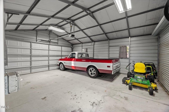 817 Mossy Oak Dr, Fuquay Varina, NC 27526 - garage with a garage door opener and metal wall