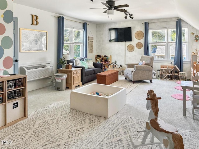 817 Mossy Oak Dr, Fuquay Varina, NC 27526 - carpeted living room with a ceiling fan and a wall unit AC
