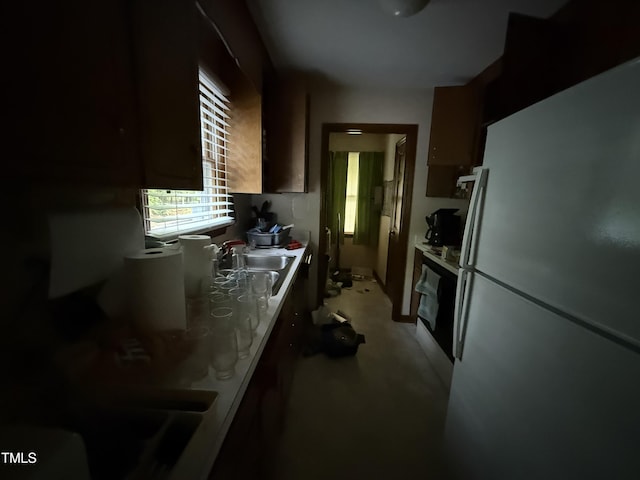 535 Hillcrest Dr, Garner, NC 27529 - kitchen featuring freestanding refrigerator, a sink, oven, and a desk