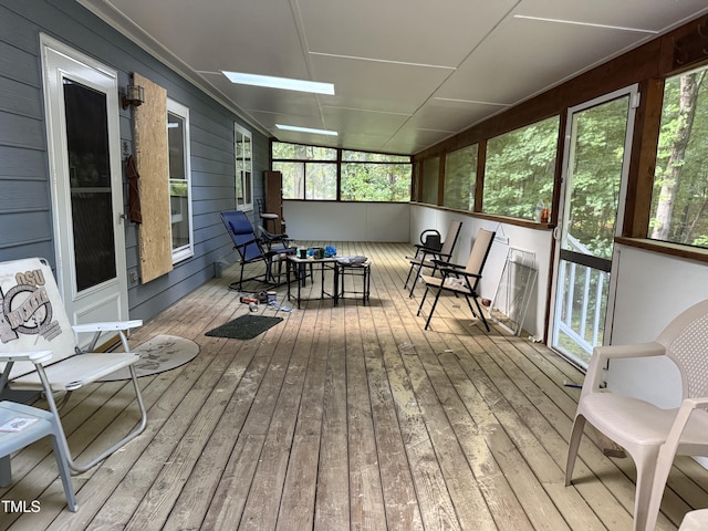 535 Hillcrest Dr, Garner, NC 27529 - sunroom / solarium featuring hardwood / wood-style flooring, wooden walls, a skylight, and a deck