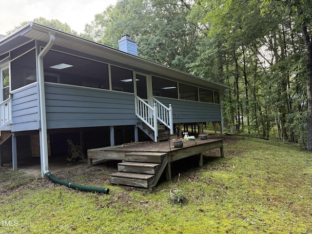 535 Hillcrest Dr, Garner, NC 27529 - rear view of property with a sunroom, a chimney, and stairway