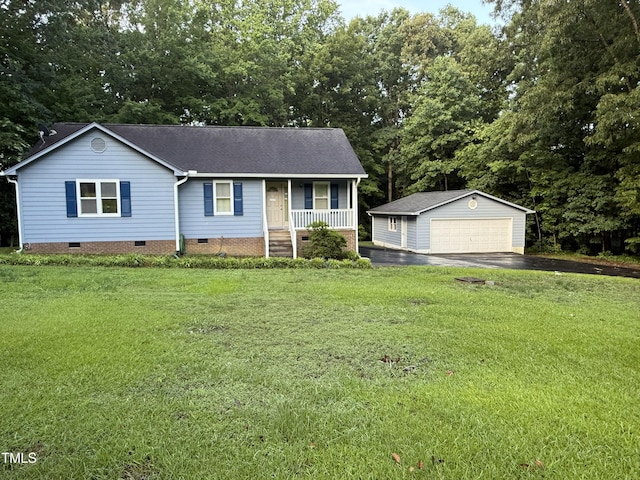 535 Hillcrest Dr, Garner, NC 27529 - view of front facade featuring covered porch, crawl space, an outbuilding, a detached garage, and a shingled roof