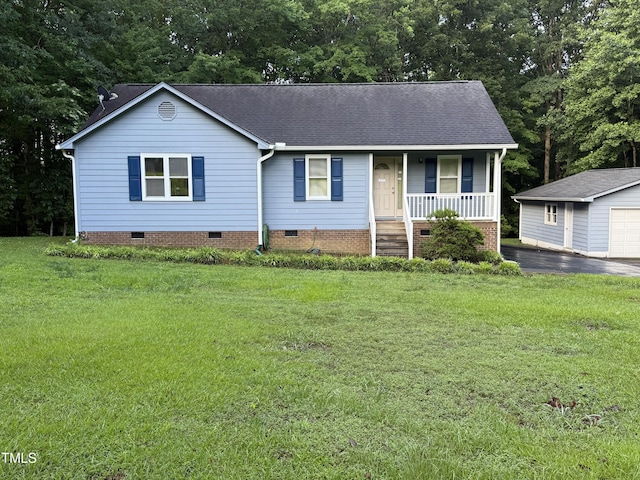 535 Hillcrest Dr, Garner, NC 27529 - view of front facade featuring crawl space, a porch, an outdoor structure, roof with shingles, and a front yard