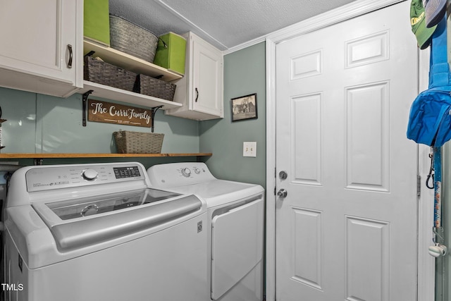 1355 Sykes Rd, Spring Hope, NC 27882 - laundry area featuring washer and clothes dryer, cabinet space, and a textured ceiling