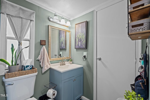 1355 Sykes Rd, Spring Hope, NC 27882 - half bath with vanity, toilet, and a textured ceiling