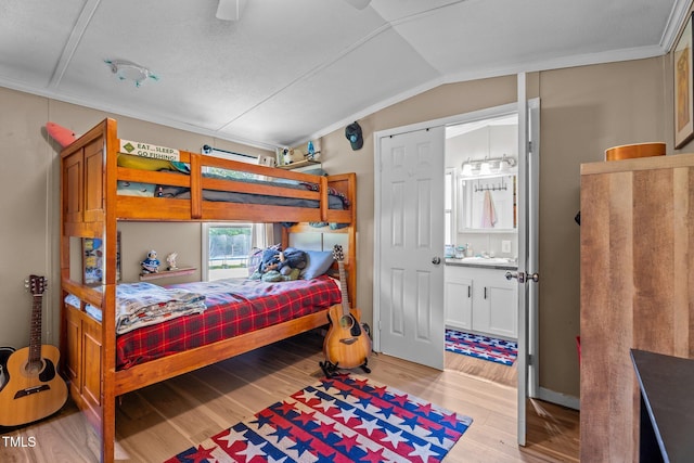 1355 Sykes Rd, Spring Hope, NC 27882 - bedroom featuring light wood-type flooring and lofted ceiling