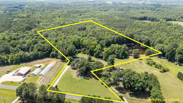 1355 Sykes Rd, Spring Hope, NC 27882 - aerial view of property's location featuring a heavily wooded area and property boundaries highlighted