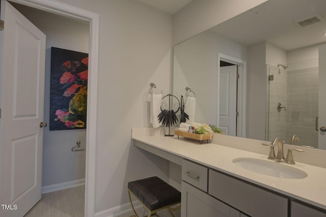 1227 Bessie Ct, Wake Forest, NC 27587 - bathroom with vanity, tiled shower, and baseboards