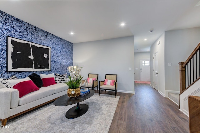 1227 Bessie Ct, Wake Forest, NC 27587 - living room featuring wallpapered walls, an accent wall, stairs, wood finished floors, and baseboards