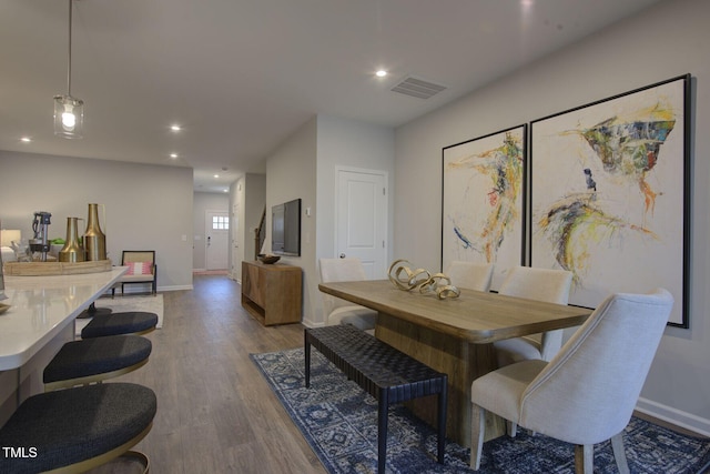 1227 Bessie Ct, Wake Forest, NC 27587 - dining space featuring wood finished floors, baseboards, and recessed lighting