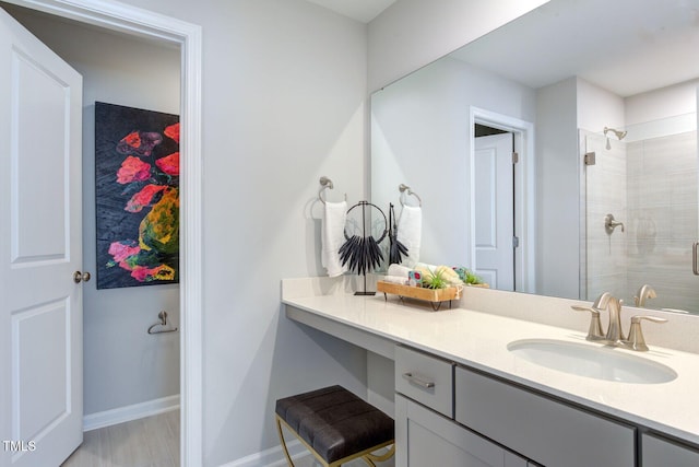 1227 Bessie Ct, Wake Forest, NC 27587 - bathroom featuring vanity, tiled shower, and baseboards