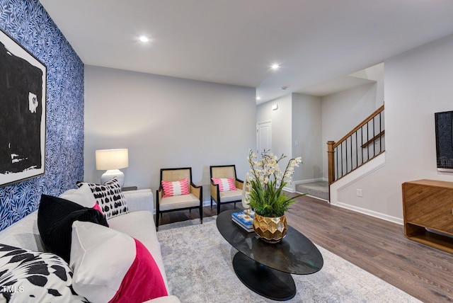 1227 Bessie Ct, Wake Forest, NC 27587 - living area featuring wallpapered walls, wood finished floors, stairway, baseboards, and recessed lighting
