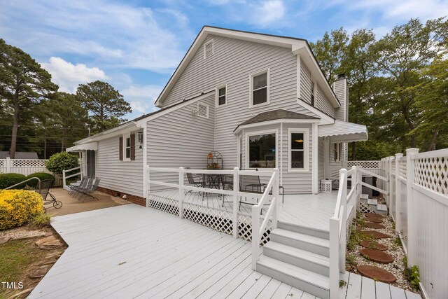 2000 Glissom St, Tarboro, NC 27886 - rear view of property with outdoor dining space, a deck, and a chimney