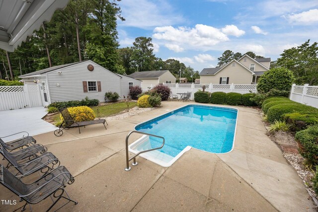 2000 Glissom St, Tarboro, NC 27886 - view of pool with a patio, a fenced backyard, and an outdoor structure