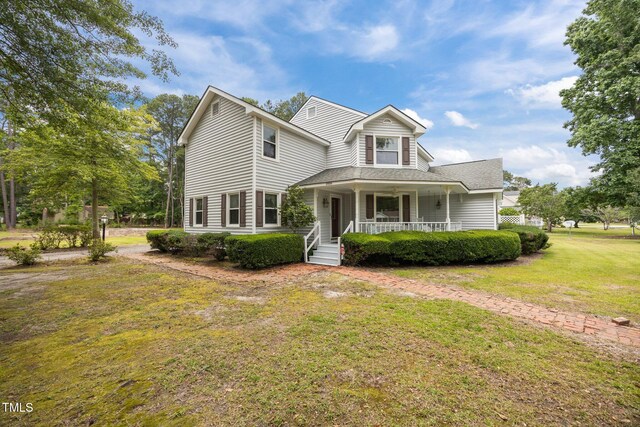 2000 Glissom St, Tarboro, NC 27886 - view of front of house with a porch, a front yard, and a shingled roof