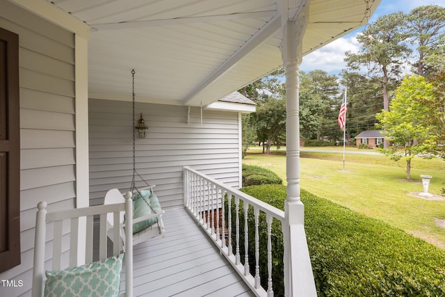 2000 Glissom St, Tarboro, NC 27886 - wooden porch featuring a yard