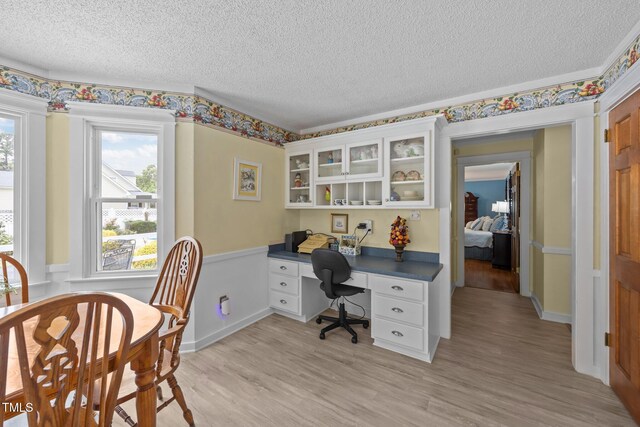 2000 Glissom St, Tarboro, NC 27886 - home office featuring a textured ceiling and light wood-type flooring