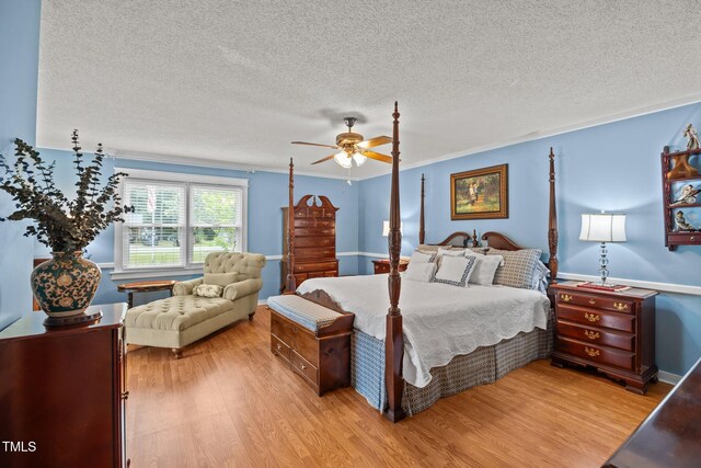 2000 Glissom St, Tarboro, NC 27886 - bedroom with light wood-style flooring, a textured ceiling, and ceiling fan