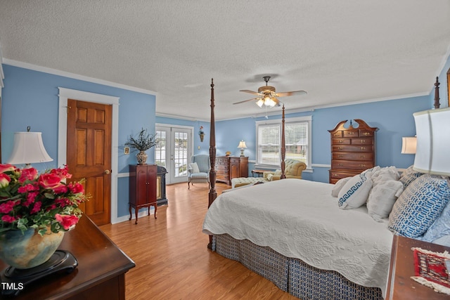 2000 Glissom St, Tarboro, NC 27886 - bedroom featuring french doors, light wood finished floors, crown molding, a textured ceiling, and a ceiling fan
