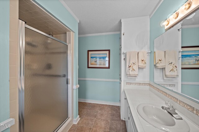 2000 Glissom St, Tarboro, NC 27886 - full bathroom with vanity, a shower stall, crown molding, a textured ceiling, and tile patterned flooring