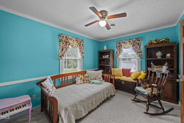 2000 Glissom St, Tarboro, NC 27886 - bedroom with a textured ceiling, carpet floors, ornamental molding, and ceiling fan