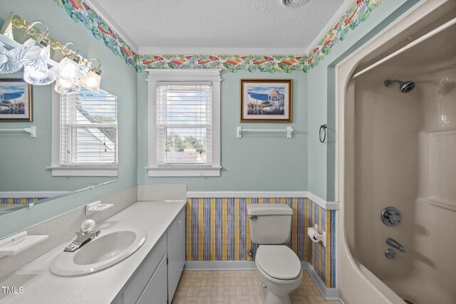 2000 Glissom St, Tarboro, NC 27886 - bathroom with wallpapered walls, vanity, a textured ceiling, healthy amount of natural light, and bathing tub / shower combination