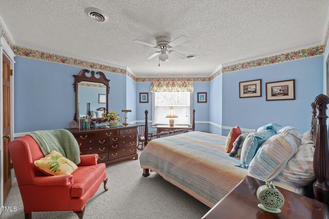 2000 Glissom St, Tarboro, NC 27886 - bedroom featuring a textured ceiling, carpet, and a ceiling fan