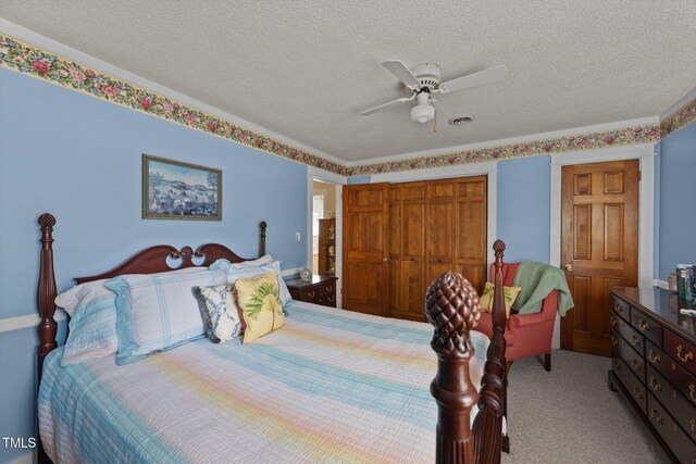 2000 Glissom St, Tarboro, NC 27886 - bedroom featuring a textured ceiling, a closet, carpet, and ceiling fan