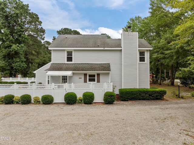 2000 Glissom St, Tarboro, NC 27886 - rear view of house with roof with shingles and a chimney