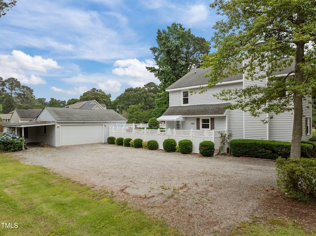 2000 Glissom St, Tarboro, NC 27886 - view of property exterior with dirt driveway, an attached garage, and a shingled roof
