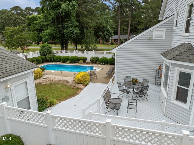 2000 Glissom St, Tarboro, NC 27886 - view of swimming pool with outdoor dining space, a deck, and a fenced backyard