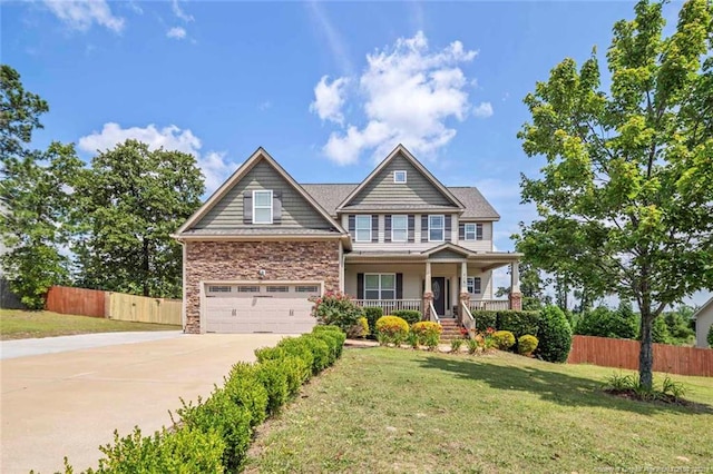 416 Kentucky Derby Ln, Lillington, NC 27546 - craftsman inspired home with covered porch, concrete driveway, a garage, and stone siding