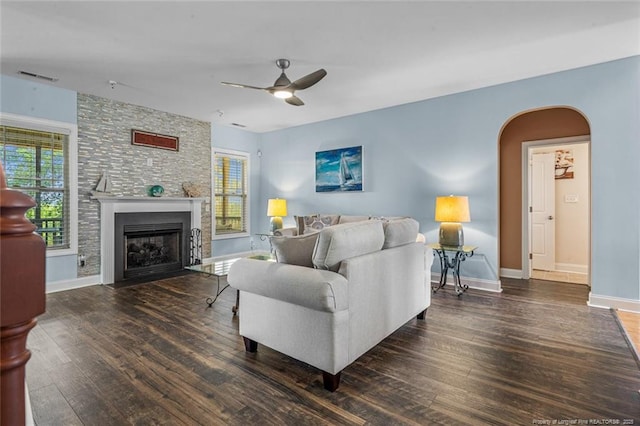 416 Kentucky Derby Ln, Lillington, NC 27546 - living room featuring arched walkways, ceiling fan, wood finished floors, and baseboards