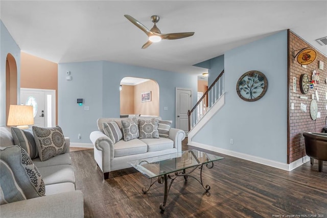 416 Kentucky Derby Ln, Lillington, NC 27546 - living area featuring arched walkways, ceiling fan, baseboards, wood finished floors, and stairs