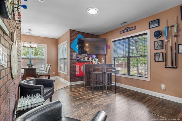 416 Kentucky Derby Ln, Lillington, NC 27546 - bar with baseboards, hardwood / wood-style floors, and a chandelier