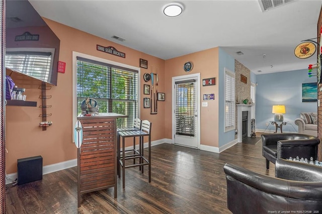 416 Kentucky Derby Ln, Lillington, NC 27546 - dining space with wood finished floors, baseboards, and a large fireplace