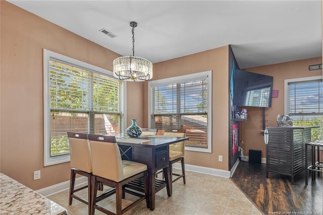 416 Kentucky Derby Ln, Lillington, NC 27546 - dining space featuring a chandelier and baseboards