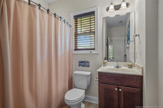 416 Kentucky Derby Ln, Lillington, NC 27546 - bathroom featuring toilet, vanity, baseboards, and a shower with shower curtain