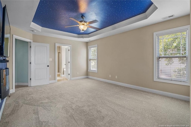 416 Kentucky Derby Ln, Lillington, NC 27546 - unfurnished bedroom with a raised ceiling, carpet floors, baseboards, ornamental molding, and ensuite bathroom