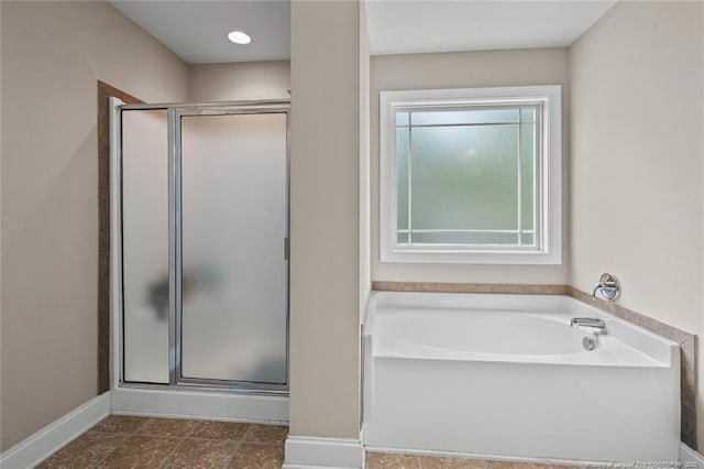 416 Kentucky Derby Ln, Lillington, NC 27546 - bathroom with a shower stall, a garden tub, and baseboards