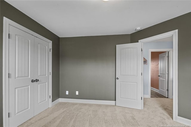 416 Kentucky Derby Ln, Lillington, NC 27546 - unfurnished bedroom with light colored carpet, baseboards, and a closet
