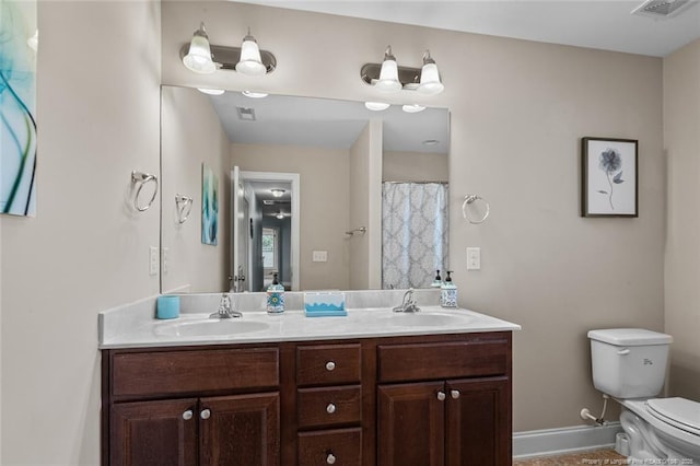 416 Kentucky Derby Ln, Lillington, NC 27546 - full bath featuring double vanity, toilet, and baseboards