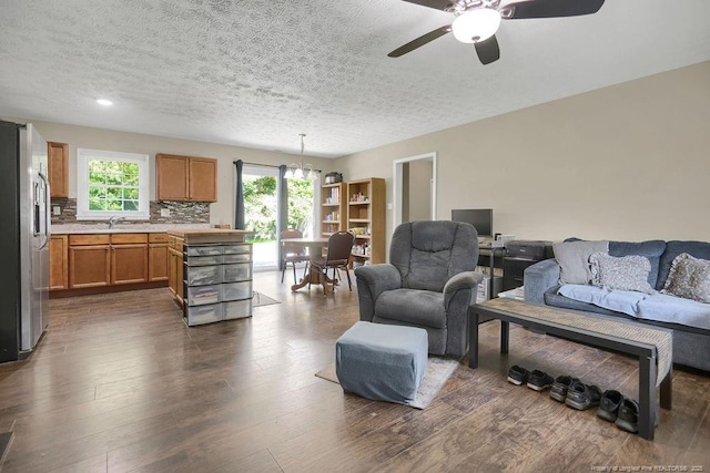 6582 Vineyard Dr, Fayetteville, NC 28304 - living area with ceiling fan, a textured ceiling, and dark wood finished floors