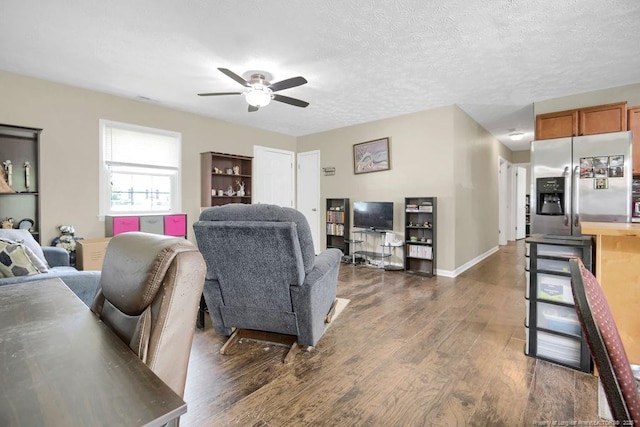 6582 Vineyard Dr, Fayetteville, NC 28304 - living area with a ceiling fan and dark wood-style flooring